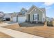 Charming two-story home with a three-car garage and well-manicured lawn at 1107 Bellwether Ln, Summerville, SC 29485