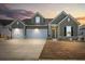 Charming two-story home with a three-car garage and well-manicured lawn at 1107 Bellwether Ln, Summerville, SC 29485