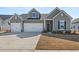 Charming two-story home with a three-car garage and well-manicured lawn at 1107 Bellwether Ln, Summerville, SC 29485