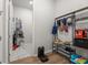 Organized mudroom with shelving, storage bins, and hooks, complemented by marble-look tile flooring at doorway at 1107 Bellwether Ln, Summerville, SC 29485