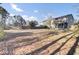 The property features a vast backyard with an open lawn, surrounded by trees and a wooden fence at 112 Avonshire Dr, Summerville, SC 29483