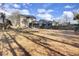 The large backyard showcases ample space, a screened porch, wooden fence, and an open grassy area at 112 Avonshire Dr, Summerville, SC 29483