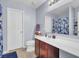Bright bathroom with a large vanity and full mirror plus coordinated floral shower curtain at 112 Avonshire Dr, Summerville, SC 29483