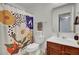 Cozy bathroom with a floral shower curtain and wood vanity offers a homey feel at 112 Avonshire Dr, Summerville, SC 29483