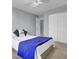 Bright bedroom features a bed with a plush blue cover, creating a relaxing retreat at 112 Avonshire Dr, Summerville, SC 29483