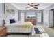 Bedroom features natural light, a ceiling fan, and ample closet space at 112 Avonshire Dr, Summerville, SC 29483