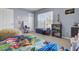 Bedroom with a large window offers natural light and a comfortable place to relax at 112 Avonshire Dr, Summerville, SC 29483