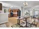 Open concept dining area adjacent to the kitchen, with a view into the living room with hardwood floors throughout at 112 Avonshire Dr, Summerville, SC 29483