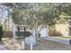 Inviting home featuring a tidy yard, an attached one-car garage, a walkway, and mature trees at 112 Avonshire Dr, Summerville, SC 29483