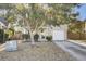 Charming single-Gathering home featuring mature landscaping, an attached one-car garage, and a welcoming front entrance at 112 Avonshire Dr, Summerville, SC 29483