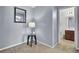 Hallway features stylish accent table and decor, leading to a modern bathroom at 112 Avonshire Dr, Summerville, SC 29483