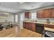 Cozy eat-in kitchen features wood cabinets, stainless steel sink, and light countertops at 112 Avonshire Dr, Summerville, SC 29483