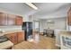 Well-lit kitchen featuring wooden cabinets, black appliances, and a connecting dining area, great for Gathering meals at 112 Avonshire Dr, Summerville, SC 29483