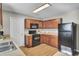 Cozy kitchen with stainless steel appliances, wooden cabinets, and good natural light at 112 Avonshire Dr, Summerville, SC 29483