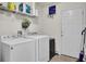 Laundry room with side by side washer and dryer, storage shelf and exterior door at 112 Avonshire Dr, Summerville, SC 29483