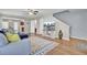 A bright living room with hardwood floors, a ceiling fan, and modern furniture, with stairs leading to the second floor at 112 Avonshire Dr, Summerville, SC 29483