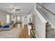 Bright living room with modern decor, hardwood floors, and a staircase at 112 Avonshire Dr, Summerville, SC 29483