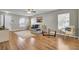 Inviting living room featuring hardwood floors, multiple windows, and comfortable seating for relaxation at 112 Avonshire Dr, Summerville, SC 29483