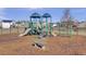 Community playground with slides, climbing equipment, and bench seating, surrounded by a safety fence at 112 Avonshire Dr, Summerville, SC 29483