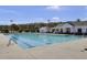 Large community pool with lane lines, a covered seating area, and mature trees at 112 Avonshire Dr, Summerville, SC 29483