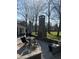 Outdoor patio with a brick fireplace, seating area, and lush greenery creates a perfect backyard retreat at 122 Mellard Dr, Goose Creek, SC 29445