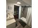 Modern bathroom featuring a walk-in shower with gray tile surround, wood-look flooring and white vanity at 122 Mellard Dr, Goose Creek, SC 29445