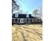 Charming brick home with a well-manicured lawn, black shutters, and a classic white front door at 122 Mellard Dr, Goose Creek, SC 29445