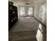 Bright living room with large windows, a stylish rug and a bookcase at 122 Mellard Dr, Goose Creek, SC 29445