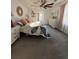 Inviting main bedroom with a large window, light colored furniture, and a cozy gray and white quilt at 122 Mellard Dr, Goose Creek, SC 29445