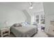 Serene bedroom with a cozy bed, a ceiling fan, soft lighting, and a window with a view at 130 River Landing Dr # 4209, Charleston, SC 29492
