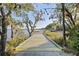Charming wooden boardwalk surrounded by lush greenery, perfect for scenic strolls near the water's edge at 130 River Landing Dr # 4209, Charleston, SC 29492