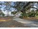 Leafy community path leading toward the water at 130 River Landing Dr # 4209, Charleston, SC 29492