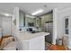 Modern kitchen with a breakfast bar, stainless steel appliances, stylish cabinetry, and sleek countertops at 130 River Landing Dr # 4209, Charleston, SC 29492