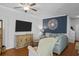 Inviting living room featuring hardwood floors, a modern TV, stylish decor, and comfortable seating arrangement at 130 River Landing Dr # 4209, Charleston, SC 29492