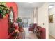 An entryway with eye-catching red walls provides a warm welcome into this charming residence at 132 Lipman St, Summerville, SC 29483