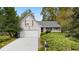 Charming single-Gathering home with gray siding, lush landscaping, and a well-manicured front yard at 132 Lipman St, Summerville, SC 29483