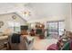 A cozy living room features a fireplace and sliding glass doors to a screened lanai at 132 Lipman St, Summerville, SC 29483