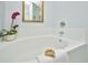 Close up on a large garden tub, accent flower and brush at 1581 Cambridge Lakes Dr, Mount Pleasant, SC 29464