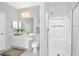 Bathroom featuring a vanity with framed mirror, a toilet and glass door shower with handheld shower head at 1581 Cambridge Lakes Dr, Mount Pleasant, SC 29464