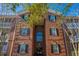 Charming brick building featuring black shutters, large windows and private screened in patios at 1581 Cambridge Lakes Dr, Mount Pleasant, SC 29464