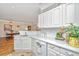 Bright kitchen with white countertops and appliances overlooking the dining area at 1581 Cambridge Lakes Dr, Mount Pleasant, SC 29464