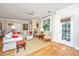 Comfortable living room with neutral colors, bright lighting, and access to outdoor space at 1581 Cambridge Lakes Dr, Mount Pleasant, SC 29464