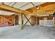 Spacious open basement with exposed wooden beams, offering potential for customization at 1615 E Ashley Ave, Folly Beach, SC 29439