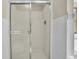 Bathroom featuring a glass-enclosed shower with tile walls and chrome fixtures at 1615 E Ashley Ave, Folly Beach, SC 29439