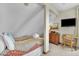 En Suite bedroom with TV and dresser at 1615 E Ashley Ave, Folly Beach, SC 29439