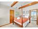 Bedroom features a wooden canopy bed with walk out to additional bedroom at 1615 E Ashley Ave, Folly Beach, SC 29439