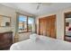 Bright bedroom with closet and window views of building across the street at 1615 E Ashley Ave, Folly Beach, SC 29439