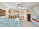 A cozy bedroom with a ceiling fan and access to another room and a small built-in bed at 1615 E Ashley Ave, Folly Beach, SC 29439