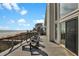 Spacious deck overlooking the ocean, featuring stylish lounge chairs and plenty of room for entertaining at 1615 E Ashley Ave, Folly Beach, SC 29439