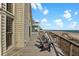 Spacious deck featuring comfortable seating, beach access, and stunning ocean views at 1615 E Ashley Ave, Folly Beach, SC 29439